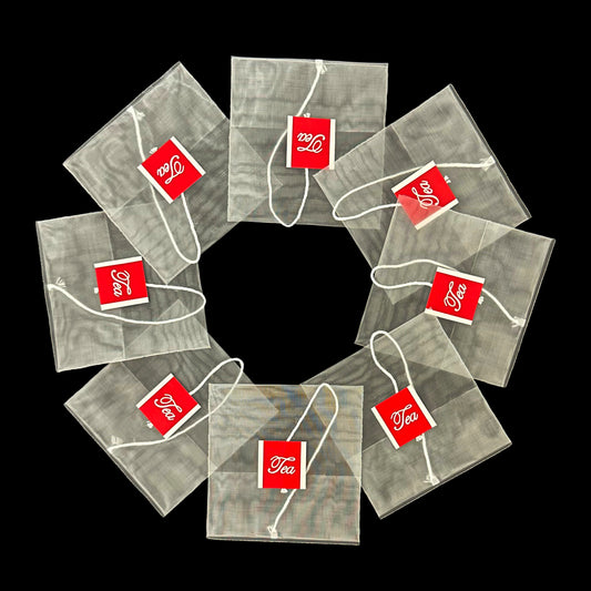 Empty Nylon disposable reverse-fold teabag with string and tag