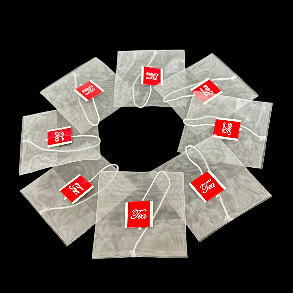 Empty Nylon disposable reverse-fold teabag with string and tag